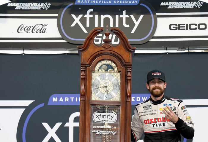 Ryan Blaney celebrates with the traditional grandfather's clock awarded to race winners at Martinsville Speedway after winning Sunday's NASCAR Cup Series Xfinity 500. sending him to the Championship 4 title-deciding race next Sunday in Phoenix. (Photo by Chris Graythen/Getty Images)